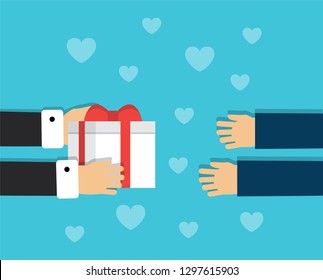One pair of hands holds a gift box with a bow and other hands want to accept a gift
