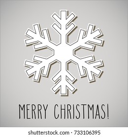 One paper cut snowflake and hand written Christmas greetings.