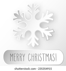 One paper snowflake and hand written Christmas greetings in a frame.