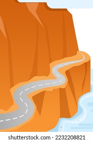 One road goes along the orange mountain below blue water