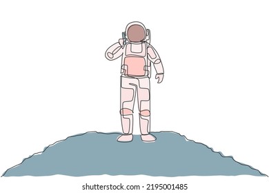 One single line drawing of cosmonaut calling his partner using smartphone in moon surface vector illustration. Astronaut business office with outer space concept. Modern continuous line draw design