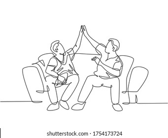 One Single Line Drawing Of Fans Siting On Sofa Watching Their Favorite American Football Club Playing The Match On Television. Fans Club Concept. Continuous Line Draw Design Vector Illustration