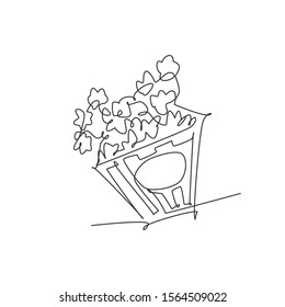 One single line drawing of fresh salty pop corn with stripped patter paper box vector graphic illustration. Snack for watching movies concept. Modern continuous line draw design