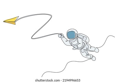 One single line drawing space man astronaut exploring cosmic galaxy, playing with paper plane graphic vector illustration. Fantasy outer space life fiction concept. Modern continuous line draw design