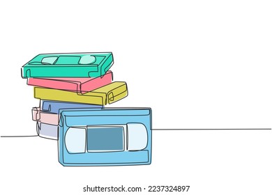 One single line drawing stack of retro old classic vhs analog video cassette. Vintage film storage tape item concept continuous line graphic draw design vector illustration