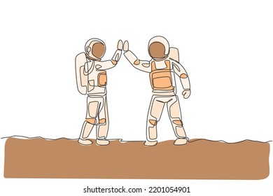 One single line drawing of two young happy astronauts gave high five while meeting on the street in moon surface vector illustration. Cosmonaut outer space concept. Modern continuous line draw design