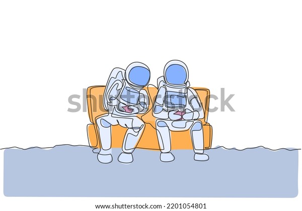 One single line drawing two young happy astronauts\
siting on sofa and playing video game in moon surface vector\
graphic illustration. Cosmonaut outer space concept. Modern\
continuous line draw\
design