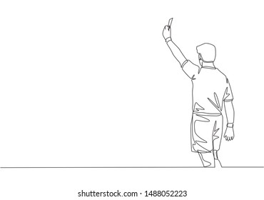 One single line drawing of young referee booked a player yellow card for the foul at the match. Soccer sports concept. Continuous line draw design vector illustration