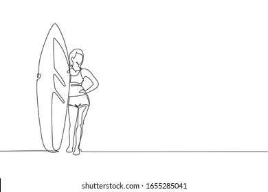 One single line drawing young sporty surfer woman with bikini standing and holding long surf board in beach vector graphic illustration. Extreme water sport concept. Modern continuous line draw design