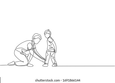 One single line drawing young father tying his son shoelaces before go to school, parenting time vector illustration. Happy family playing together concept. Modern continuous line graphic draw design