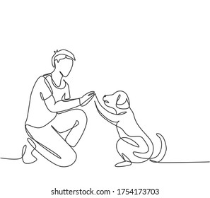 One single line drawing of young happy boy giving high five gesture to his puppy dog at outfield park. Pet care and friendship concept. Continuous line draw graphic design vector illustration