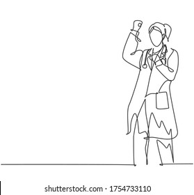 One single line drawing of young happy female doctor fist his hands to the air to celebrate his success treat the patient. Medical health care concept continuous line draw design vector illustration