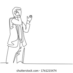 One single line drawing of young male startup CEO walking and holding a smartphone to receive call from his colleague. Business talk concept continuous line draw design vector graphic illustration