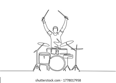 One single line drawing of young happy male drummer raise drumstick up while play drum set on music concert stage. Musician artist performance concept continuous line draw design vector illustration