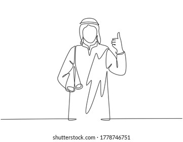 One single line drawing of young happy muslim architect bring building floor plan while thumb up. Saudi Arabia cloth shmag, kandora, headscarf, thobe. Continuous line draw design vector illustration