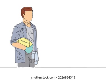 One single line drawing of young attractive builder constructing holding helmet. Building construction service concept continuous line draw design illustration