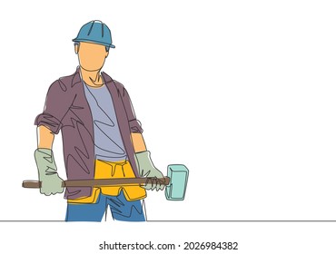 One single line drawing of young construction builder wearing uniform, tools belt and helmet while holding hammer. Craftsman home repair service concept. Continuous line draw design illustration