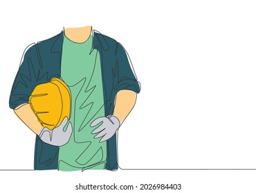 One single line drawing of young handyman wearing uniform while holding helmet. Workman building maintenance service concept. Continuous line draw design illustration