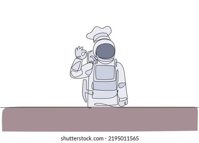 One single line drawing of young astronaut chef giving okay taste gesture for delicious food vector illustration. Delicious space galaxy dish concept. Modern continuous line draw design graphic