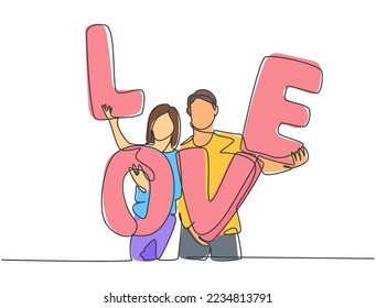 One single line drawing of young happy couple man and woman holding LOVE letter balloon after proposal marriage event. Romantic love concept continuous line draw graphic design vector illustration