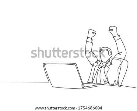 One single line drawing of young happy male manager sitting on chair and clenched fist raised in the air in front of computer. Success business deal concept continuous line draw design illustration