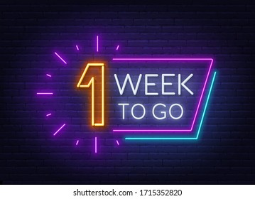 One Week To Go Neon Sign On Brick Wall Background.