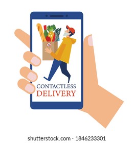 Online application. Delivery. Contactless delivery. A courier in a medical mask delivers food. Online purchases during the quarantine.