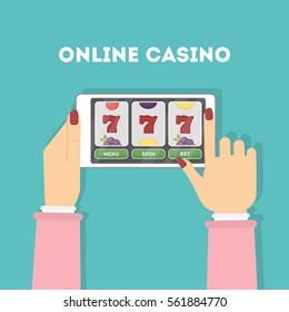 Online casino in the tablet. Hands holding device with gambling game. Gaming addiction. Woman.