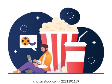 Online cinema concept. Man sits with laptop near large box of popcorn. Metaphor of entertainment and rest after work. Young guy watches movies and series on Internet. Cartoon flat vector illustration svg