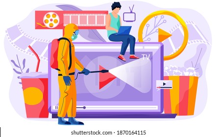 Online cinema, internet streaming. Guy holding laptop, sitting on the monitor looking at the screen. Watch movie online at home. Man in protective suit from epidemiological service doing disinfection