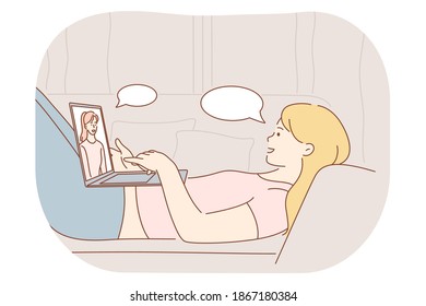 Online communication, chatting, video call concept. Young smiling woman cartoon character relaxing in bed with laptop and communicating with friend online during video call illustration 