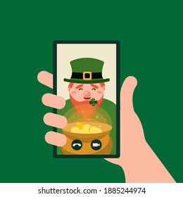 Online congratulations with Patricks day. Hand holding smartphone video player window with Leprechaun and pot.Video call concept. Chatting on phone. Vector illustration for web sites banners design