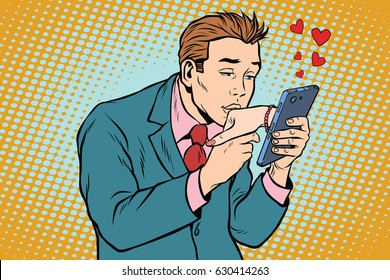 online date and love a man kisses a womans hand via smartphone. Pop art retro vector illustration