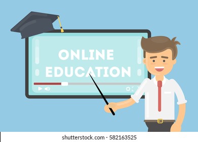 Online education concept. Teacher with pointer shows at the screen. Graduating hat.