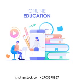 Online education flat design. A man's character is sitting at a desk studying with an online course with a smartphone and books background.
