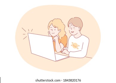 Online education, technology, communication concept. Happy captivated boy girl brother sister sitting together and studying remotely at laptop. Wireless learning communication and digital technologies