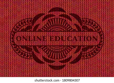 ONLINE EDUCATION text inside Red color woolen fabric realistic badge. Cloth luxurious background. Artistic illustration. 