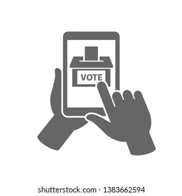 Online or electronic voting icon concept. Hand holding tablet and pointing to a ballot box on the screen with vote text on it