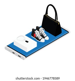 Online fashion shopping concept. Women handbag, shoes and stack of t-shirt lying on smartphone screen