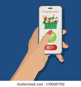 Online food delivery application concept. Female hand holding a smartphone with mobile app on classic blue background with supermarket basket full of grossery on screen. Vector flat illustration.