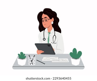 Online medical consultation on a digital tablet. Smiling female doctor wearing white uniform holding tablet pc.