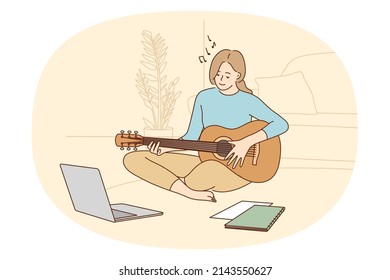 Online music lessons and learning concept. Smiling girl sitting playing guitar studying online looking at laptop on floor at home vector illustration 