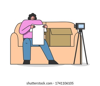 Online parcel unpacking. Female video blogger influencer unboxing and reviewing purchase clothes during live broadcast on channel. Cartoon vlogger shopping and marketing concept. Vector illustration