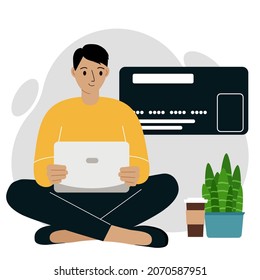 Concepto de pago en línea. Cierre de una gran tarjeta de crédito. Un hombre se sienta de piernas cruzadas, sosteniendo una laptop en la mano. Ilustración plana del vector