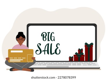 Online shopping. Big sale. A woman sits cross-legged in his hands holding a shopping card. Next to a laptop with gifts. Vector flat illustration