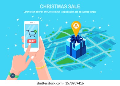 Online shopping concept. Buy in retail shop by internet. Discount christmas sale. 3d isometric gift box with pin, marker on map. Mobile phone, smartphone with application in hand. Vector design