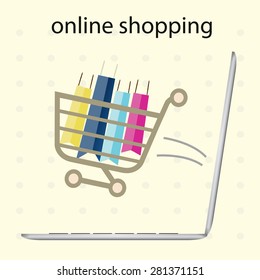 Online shopping concept  with computer, shopping bags, shopping cart