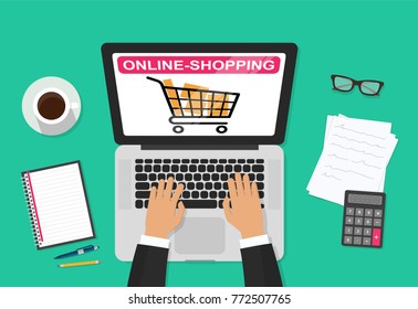 Online shopping concept desktop with computer, table, shopping bags, credit cards, coupons and products