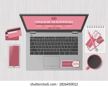 Online shopping concept. Online store website on computer screen.. Workspace with laptop, smartphone, credit cards and discount coupons. Top view, flat lay. Vector illustration