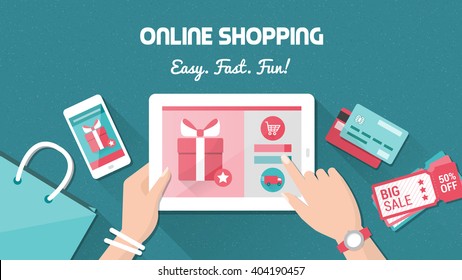 Online shopping and delivery concept, woman buying fashion products from an e-shop using a digital touch screen tablet, flat lay